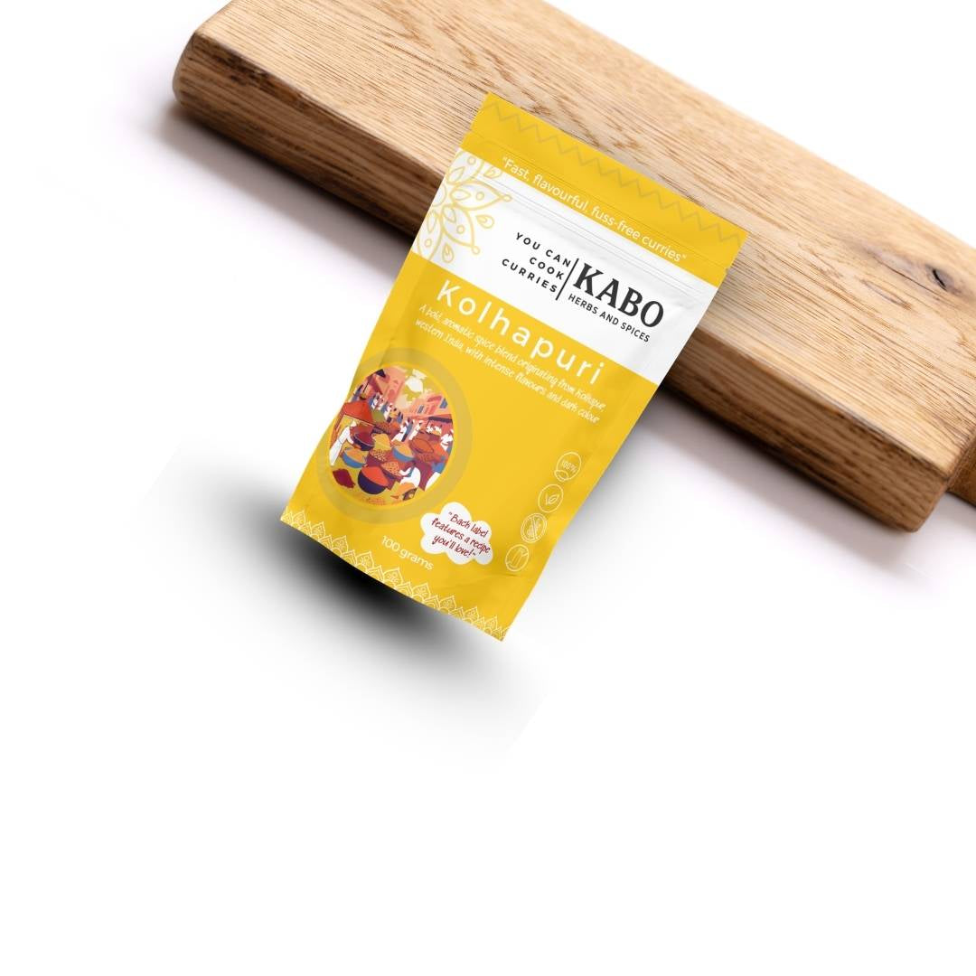 "KABO Kothapuri packaging with a wooden spatula on a whitec background"